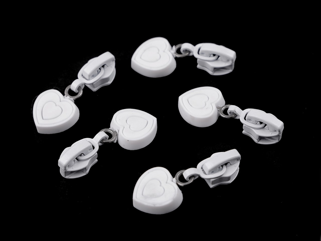 Textillux.sk - produkt Jazdec k špirálovým zipsom 6 mm srdce - biela